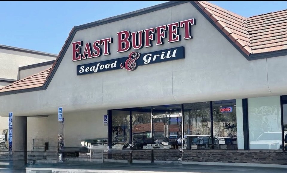 Wide buffet spread with Pan-Asian dishes.